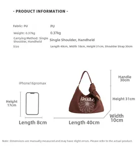 Detailed size comparison of the brown daisy tote bag next to a smartphone
