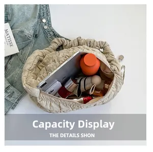 Capacity display of beige cloud tote bag with tablet, water bottle and cosmetics