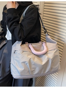 Large gray-purple shoulder travel bag with geometric pattern and pink soft handles