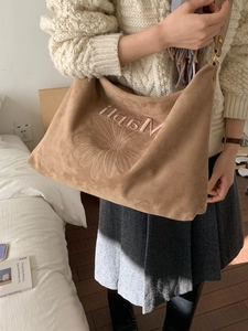 Large brown suede tote bag with daisy embroidery and shoulder strap for casual wear