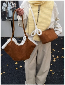 Detail of brown faux suede tote and crossbody set with cozy white faux fur trim