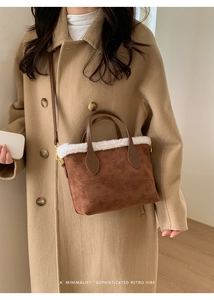 Detail of vintage brown tote with fleece trim and embossed floral pattern texture
