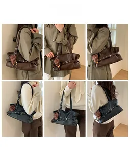 Detailed view of vintage oil wax leather tote bag with decorative buckle and turtle charm