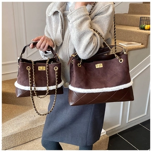 Detail showing brown suede quilted handbags with white faux fur trim and gold chain