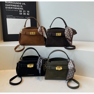 Detail showing CHERIMATE suede handbags in four colors with silk scarves and metal locks