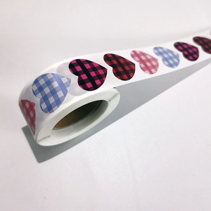 Colorful buffalo plaid heart stickers roll for Valentine gift wrapping and DIY decor