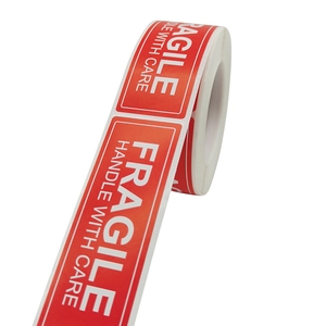 Red fragile handle with care shipping labels roll for professional package protection
