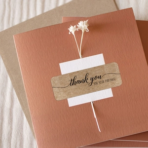 Rectangle kraft paper Thank You stickers on brown envelope with decorative flowers