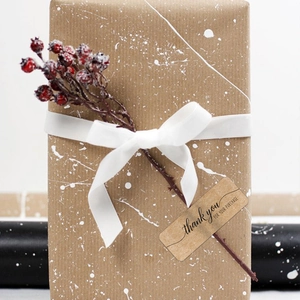 Rectangular kraft paper Thank You sticker on gift box with ribbon and red berry decor