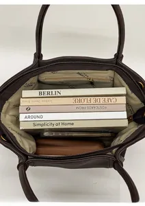Interior view of spacious dark brown tote bag with large capacity for books and wallet