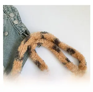Detail of soft leopard print plush shoulder strap for women's crossbody phone bag