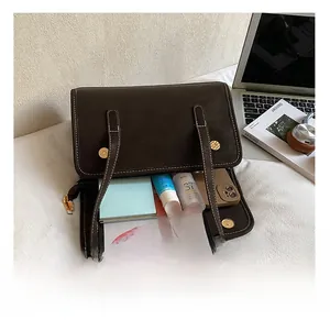 Detail view of large capacity dark brown tote bag showing spacious interior for essentials