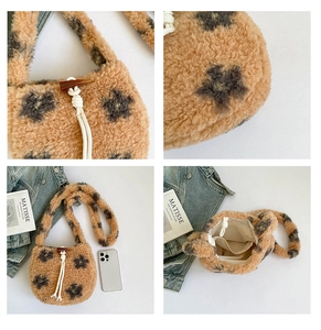 Detail of plush lamb wool bucket bag showing star pattern and toggle closure
