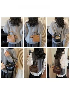 Vista multi-angolo di una borsa a secchiello in pelle con chiusura metallica