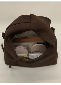 Top view showing the spacious interior and storage capacity of the dark brown shoulder bag