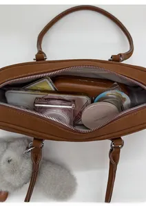 Detailed overhead view showing the spacious interior of the brown vintage leather hobo bag
