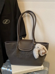 Minimalist coffee brown tote bag in matte leather with decorative contrast stitching