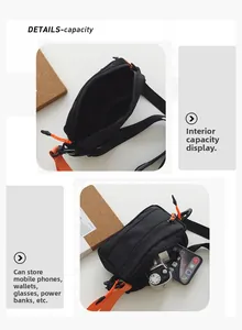 Detail of black crossbody bag with orange strap and organized inner compartments