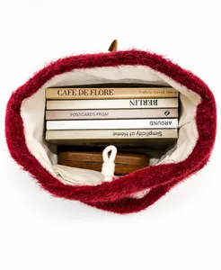 Top view of red faux fur bucket bag showing spacious interior with drawstring closure