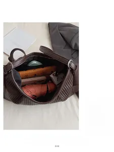 Top view of large capacity brown pleated handbag showing spacious interior and storage