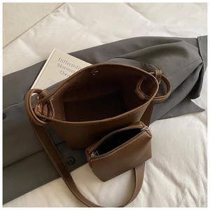 Brown lychee grain bucket bag set with white contrast stitching and matching pouch
