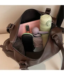 Detailed view of the large capacity interior of the coffee brown tote bag for women