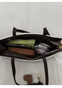 Macro view of plush tote bag interior showing large capacity for phone and wallet