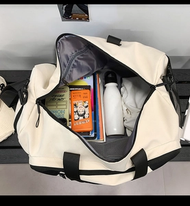 Top view of spacious interior with compartments for tablet, water bottle and clothes