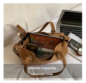 Large capacity brown leather tote bag interior showing space for iPad and essentials