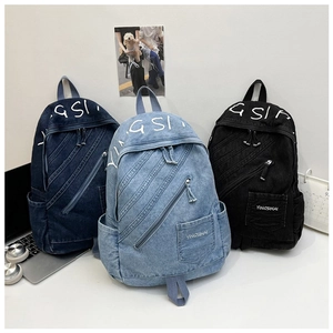 Detailed comparison of vintage denim backpacks in dark blue, light blue, and black colors