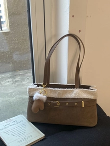 Brown faux suede tote bag with white faux fur trim and heart pendant detail