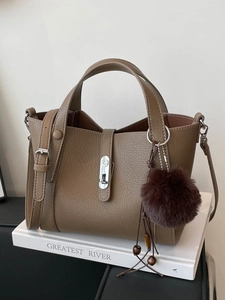 Retro deep brown lychee leather bucket tote bag with silver twist lock and plush charm