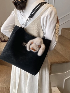 Minimalist black tote bag with silver chain strap and cute rabbit pendant for women