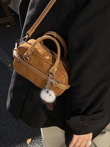 Brown Boston handbag in suede and leather with plush charm and adjustable strap