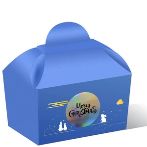 Detail of blue gift box with bunny pattern and laser Merry Christmas sticker seal