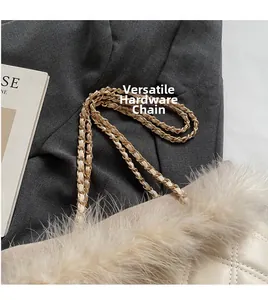 Detail of cream quilted tote bag featuring plush faux fur trim and gold metal chain strap