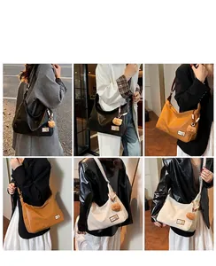 Detail view of large hobo tote bags in black, brown, and beige with cute bear charm