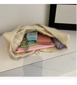 Interior view of knitted fluffy shoulder bag showing high capacity for tablets and more