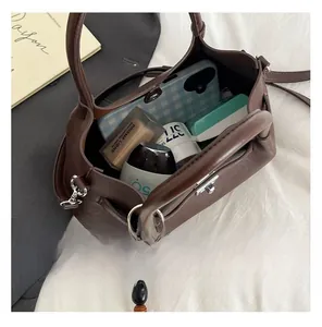 Interior view of brown pebble leather handbag showing organized storage space and capacity
