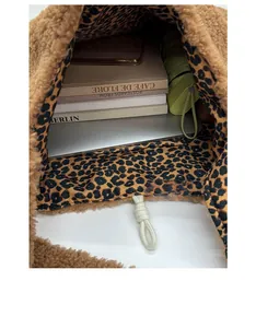 Macro shot of large capacity plush tote bag interior with leopard print lining and items