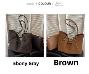 Detailed view of large tote bag in ebony grey and brown with matching inner pouches