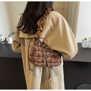 Brown plaid underarm bag featuring teddy bear print and ruffle leather shoulder strap detail