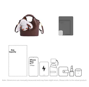 Detail of retro brown bucket bag showing capacity for phone and daily accessories