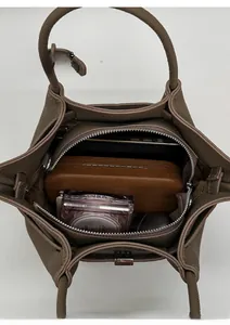 Top view of the brown leather bucket bag showing internal zipper compartment and large capacity