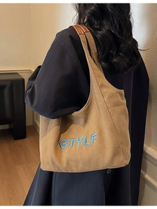 Large khaki canvas tote bag with blue letter embroidery and brown leather shoulder straps