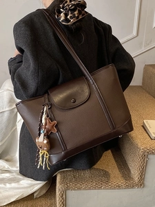 Minimalist large brown lychee texture leather tote bag with cute bear charm on shoulder