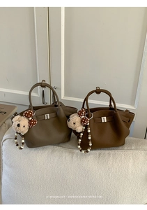 Detailed close-up of retro leather handbags with beaded straps and cute teddy bear charms