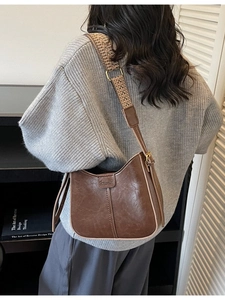 Brown vintage half-moon bucket bag with jacquard wide strap for stylish daily wear