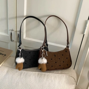 Retro polka dot underarm bags in black and brown with cute glove plush keychains