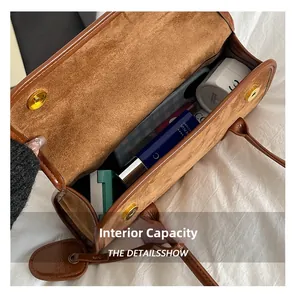 Internal view of the brown shoulder bag showing spacious capacity for daily cosmetics